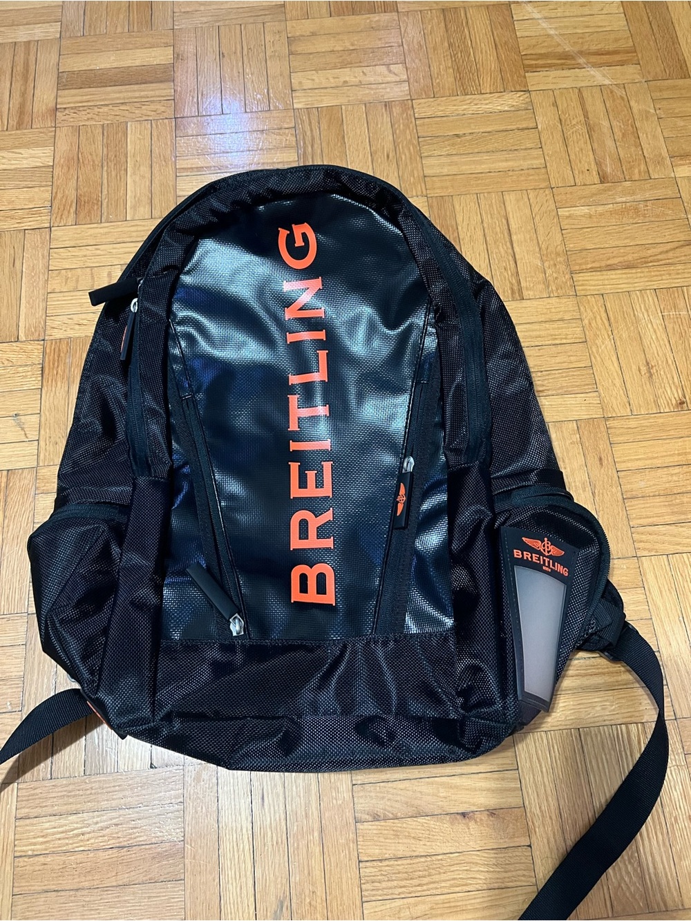 Breitling Black Backpack with Orange Logo Accent